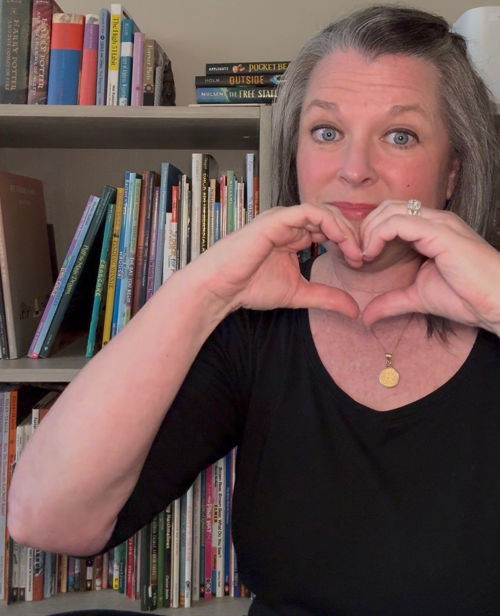 Kim Baust making a heart with her hands