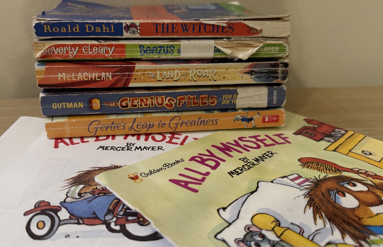 A stack of well-loved, well-worn children's novels and picture books